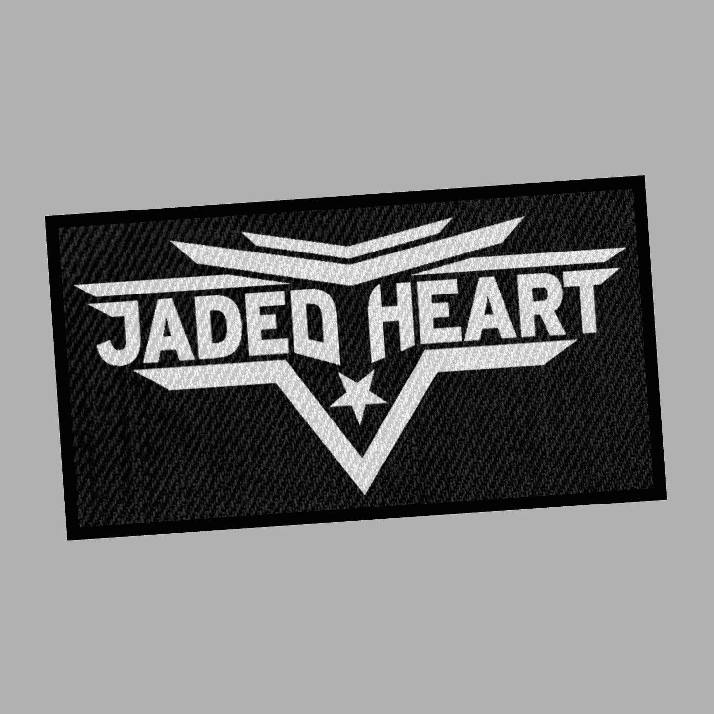 Jaded Heart Patch featuring bold white text and star emblem on a black textured background.