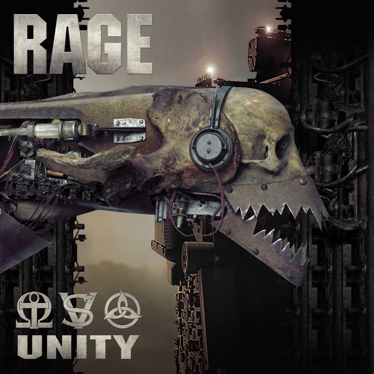 Close-up of Rage LP 'Unity' album cover showing mechanical skull with headphones and sharp teeth, set against an industrial background. Heavy metal vinyl art.