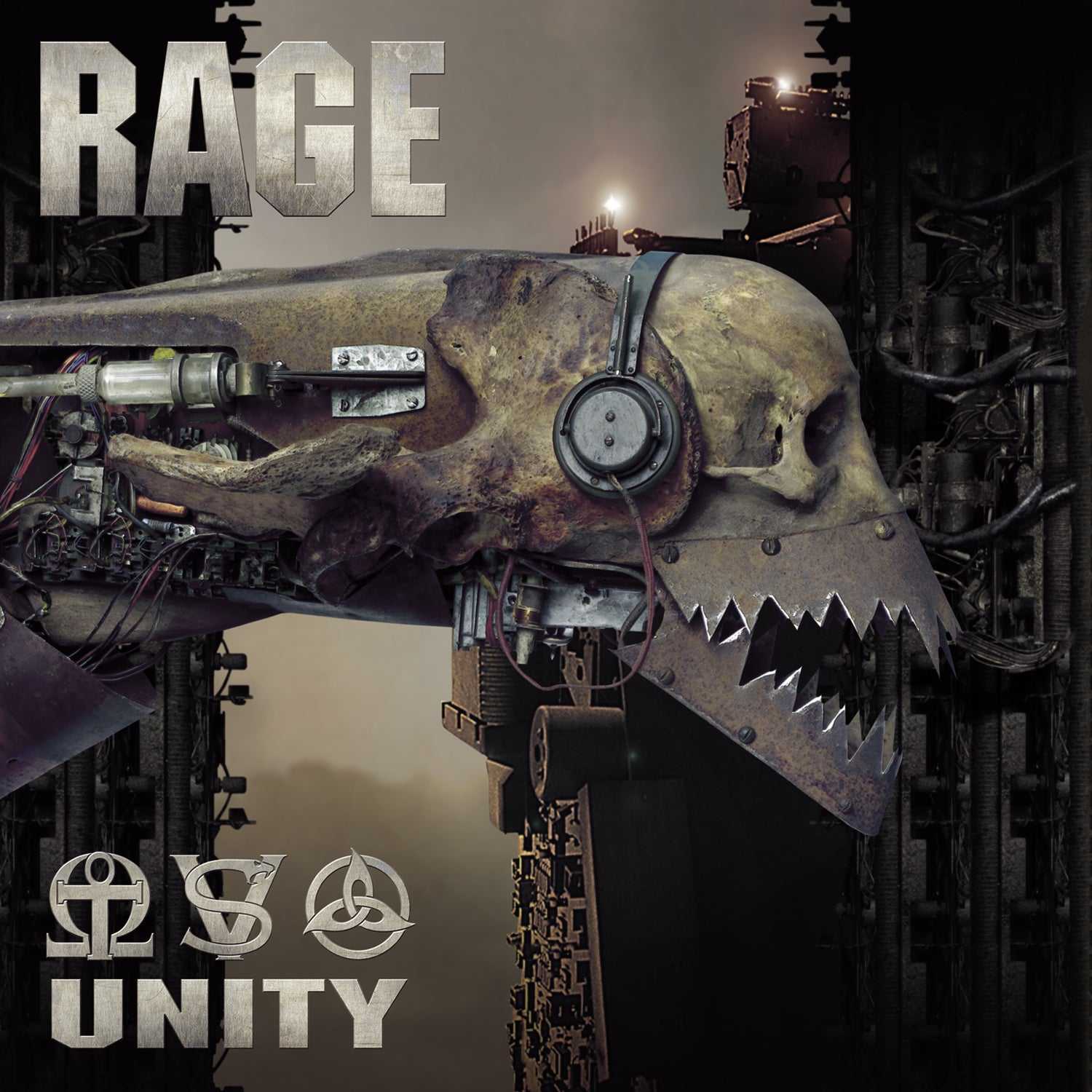 Close-up of Rage LP 'Unity' album cover showing mechanical skull with headphones and sharp teeth, set against an industrial background. Heavy metal vinyl art.
