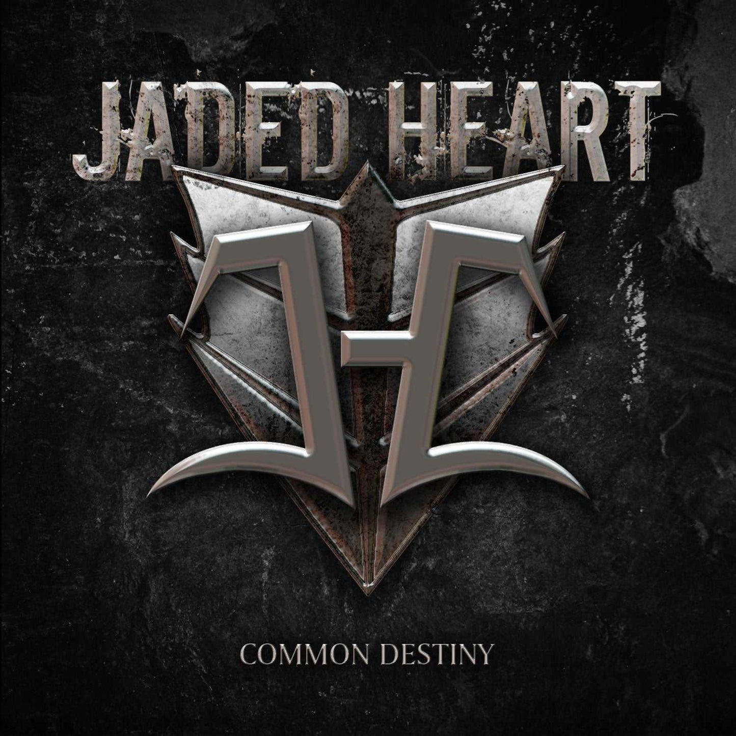Close-up of Jaded Heart 'Common Destiny' LP cover with bold metallic logo and distressed black background. Perfect for heavy metal vinyl enthusiasts.