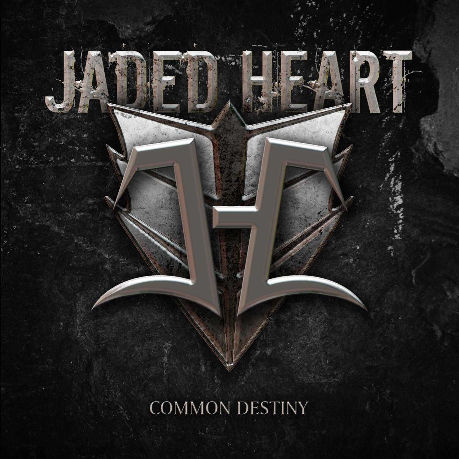 Close-up of Jaded Heart 'Common Destiny' LP cover with bold metallic logo and distressed black background. Perfect for heavy metal vinyl enthusiasts.