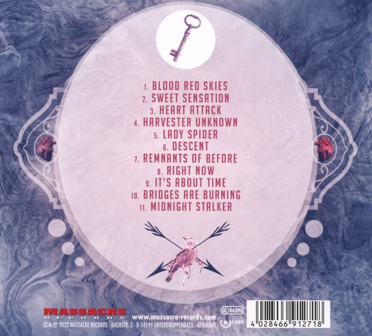 Back cover of Jaded Heart LP 'Heart Attack' Vinyl listing 11 tracks with a key and heart-themed artwork, distributed by Massacre Records.