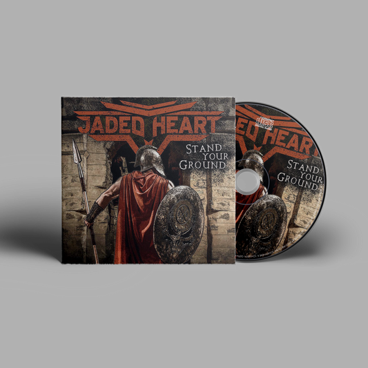 Jaded Heart CD 'Stand Your Ground' in digipack format featuring warrior-themed cover art with shield and spear. Hard rock music CD for collectors.