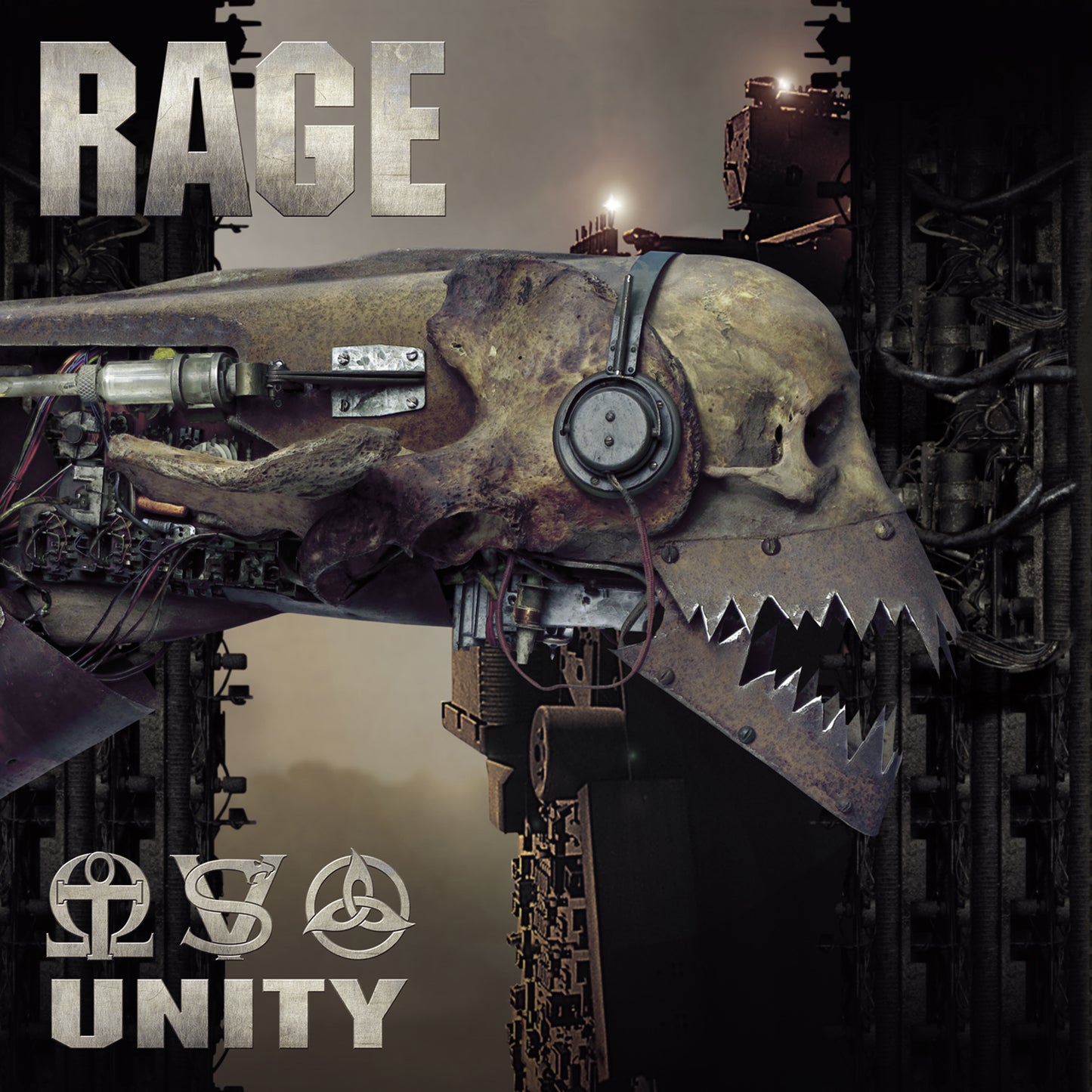 Close-up of Rage LP 'Unity' album cover showing mechanical skull with headphones and sharp teeth, set against an industrial background. Heavy metal vinyl art.